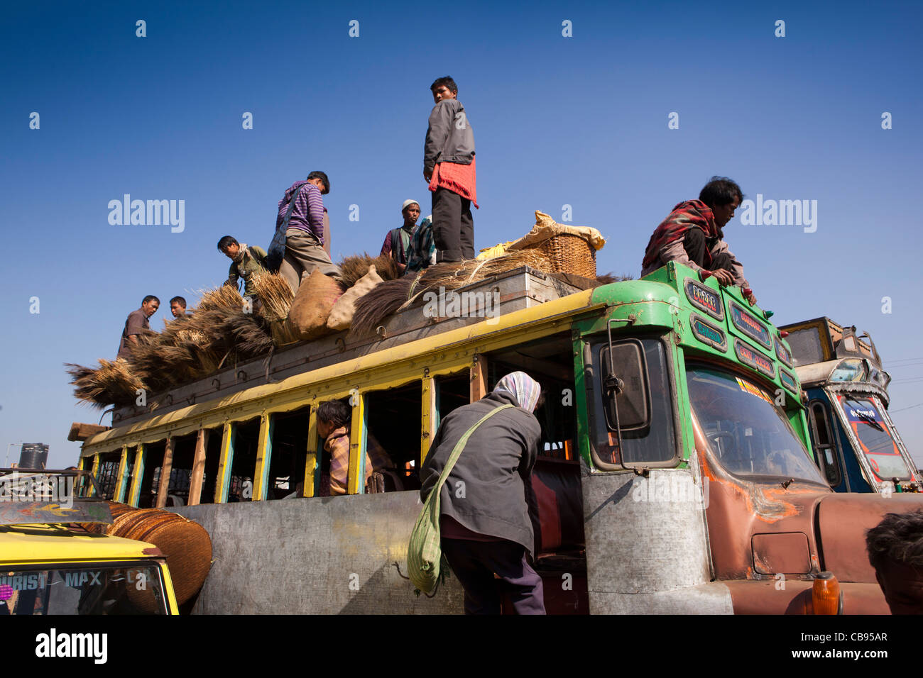 India, Meghalaya, Jaintia Hills, Shillong district, Ummulong Bazar, people sitting on top of local bus Stock Photo