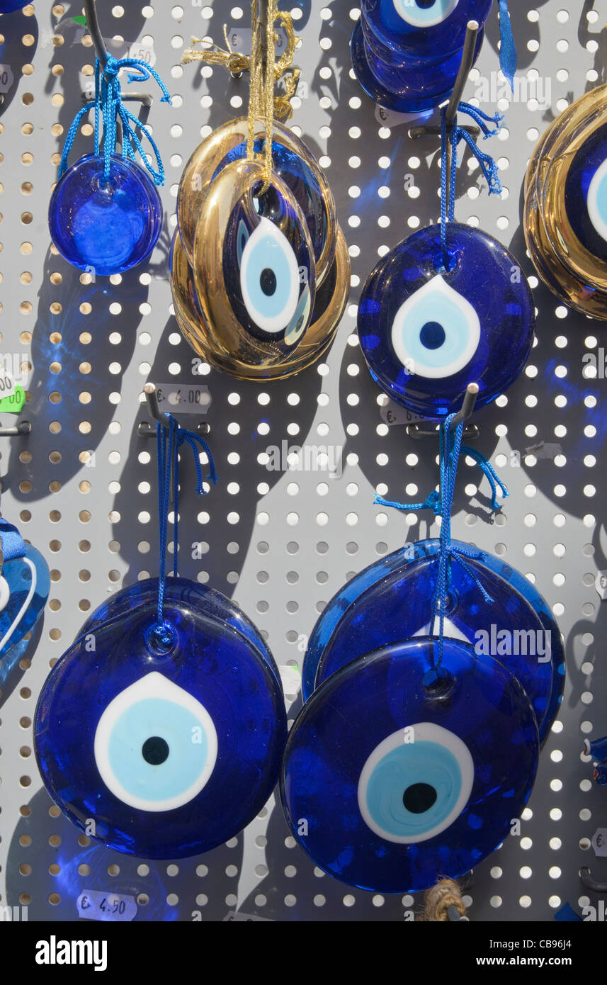Eye-shaped souvenir jewelry believed to protect the superstitious against the evil eye, Patmos, Greece Stock Photo