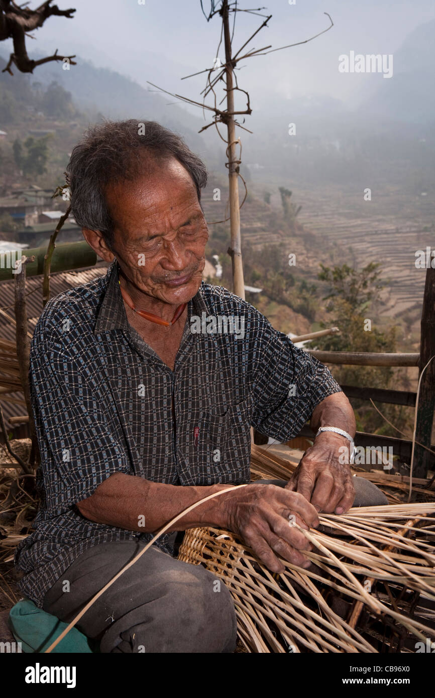 India, Nagaland, Khonoma Village, crafts, old man weaving basket Stock Photo