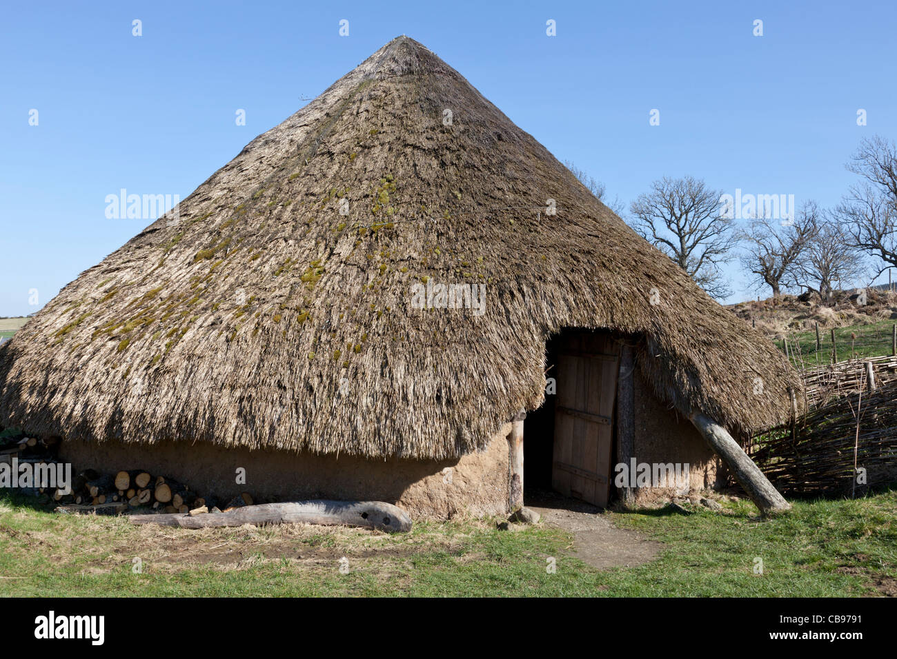 Replica neolithic thatched house Scotland Stock Photo
