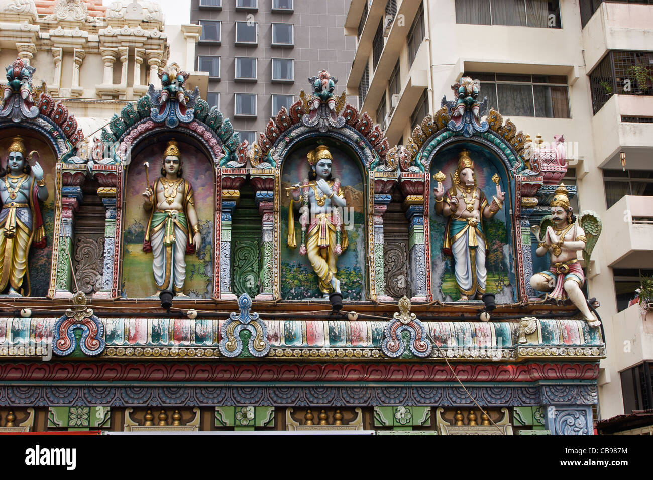 Godly statues above the entrance of the Sri Krishnan Temple, Singapore. Stock Photo