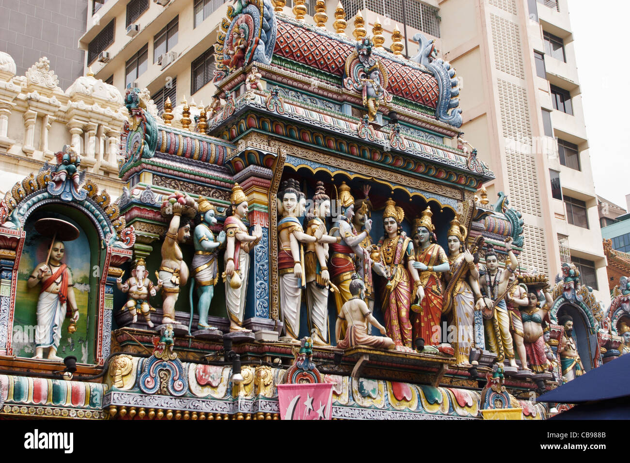 Godly statues above the entrance of the Sri Krishnan Temple, Singapore. Stock Photo