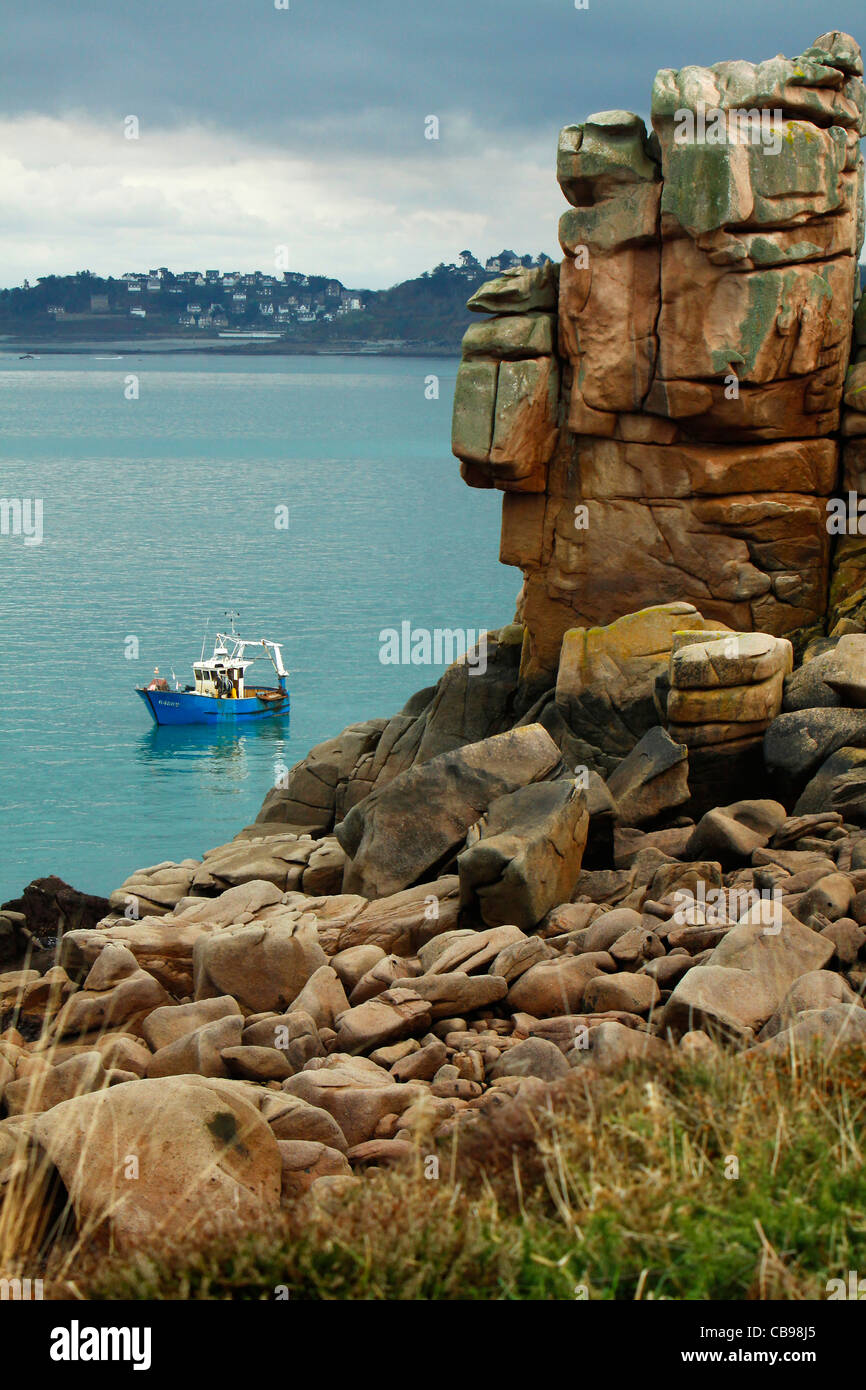 Perros Guirec coast pink granite over ploumanac'h, fishing boat lobster and crab trap Stock Photo