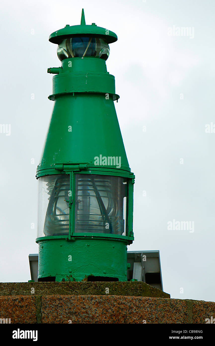 Green lighthouse of entrance to the harbour of Perros Guirec Stock Photo