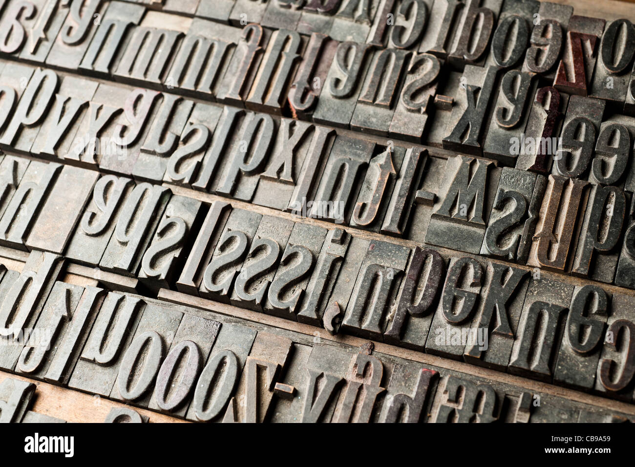 a tray of carved wooden letters, part of a letterpress set. Stock Photo