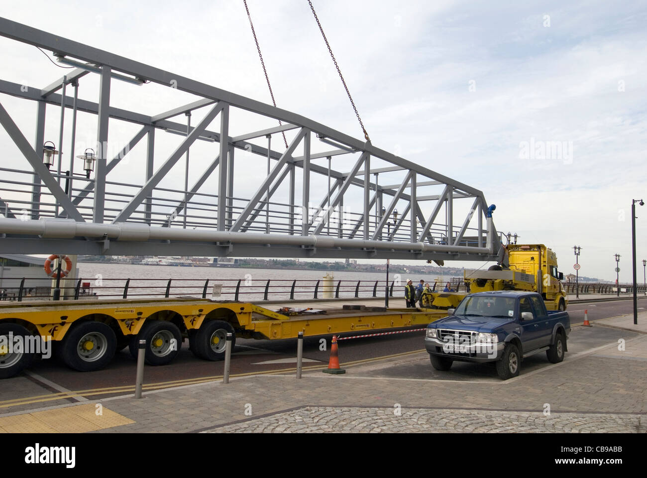 Pontoon bridge being lifted onto a low loader heavy goods vehicle, Liverpool, England, UK Stock Photo
