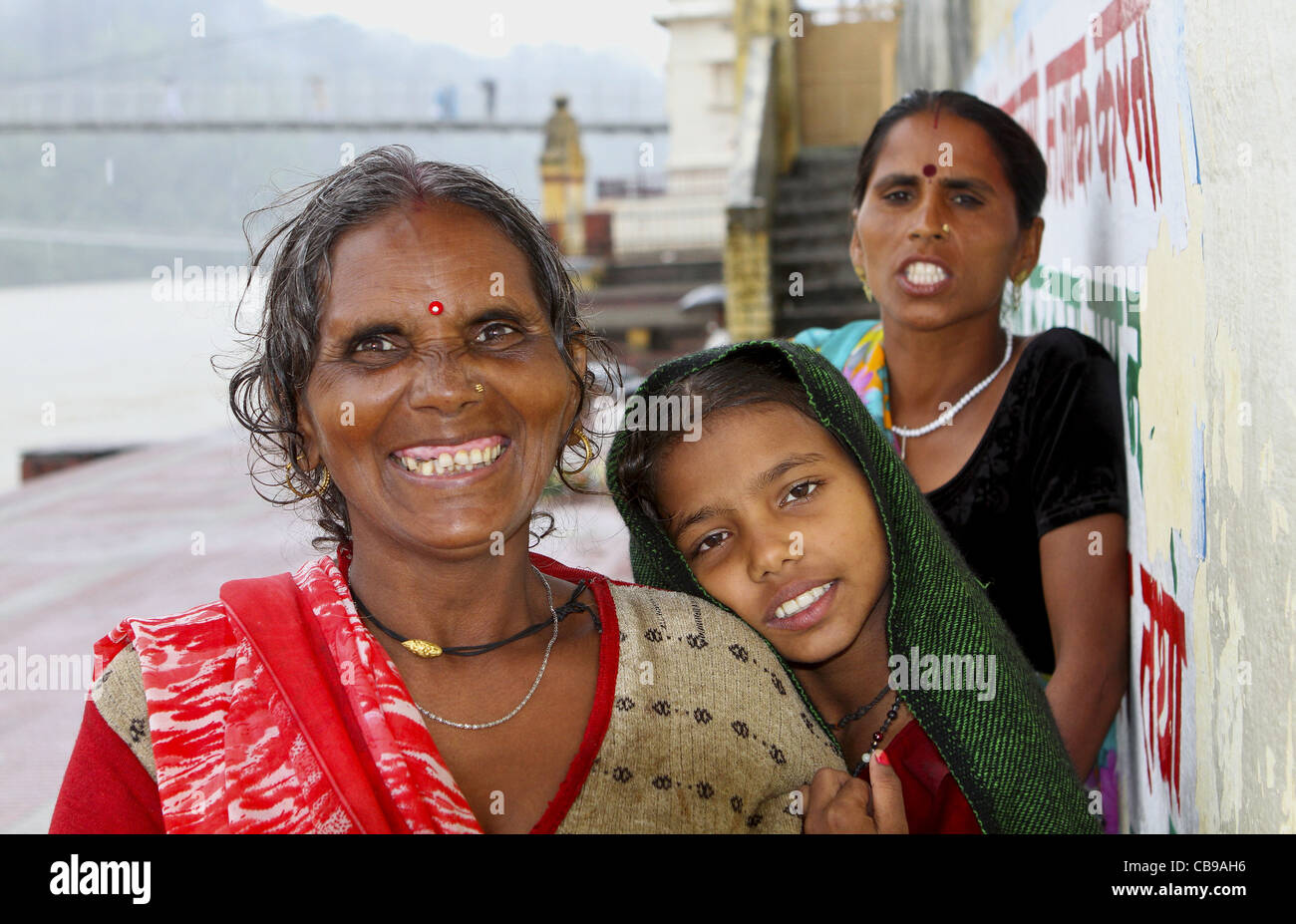 3 generations of an Indian Family at the Ganges river. Rishikesh. India Stock Photo