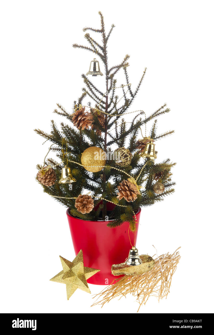 Christmas tree in red pot with golden ornaments Stock Photo Alamy