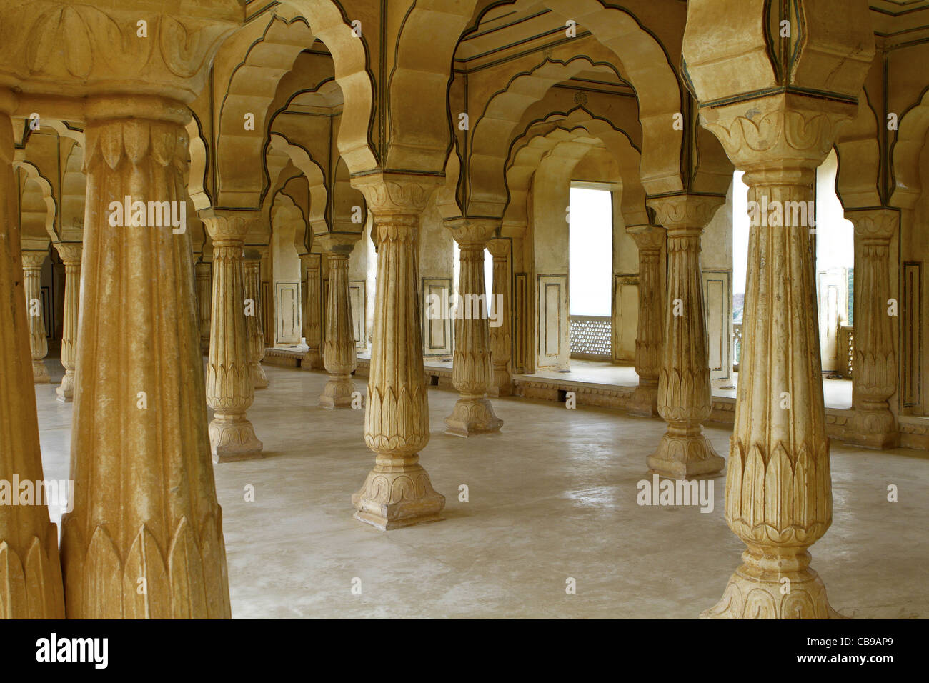 Ornate carved stone pillars in Amber Fort. Jaipur. Rajasthan. India Stock Photo