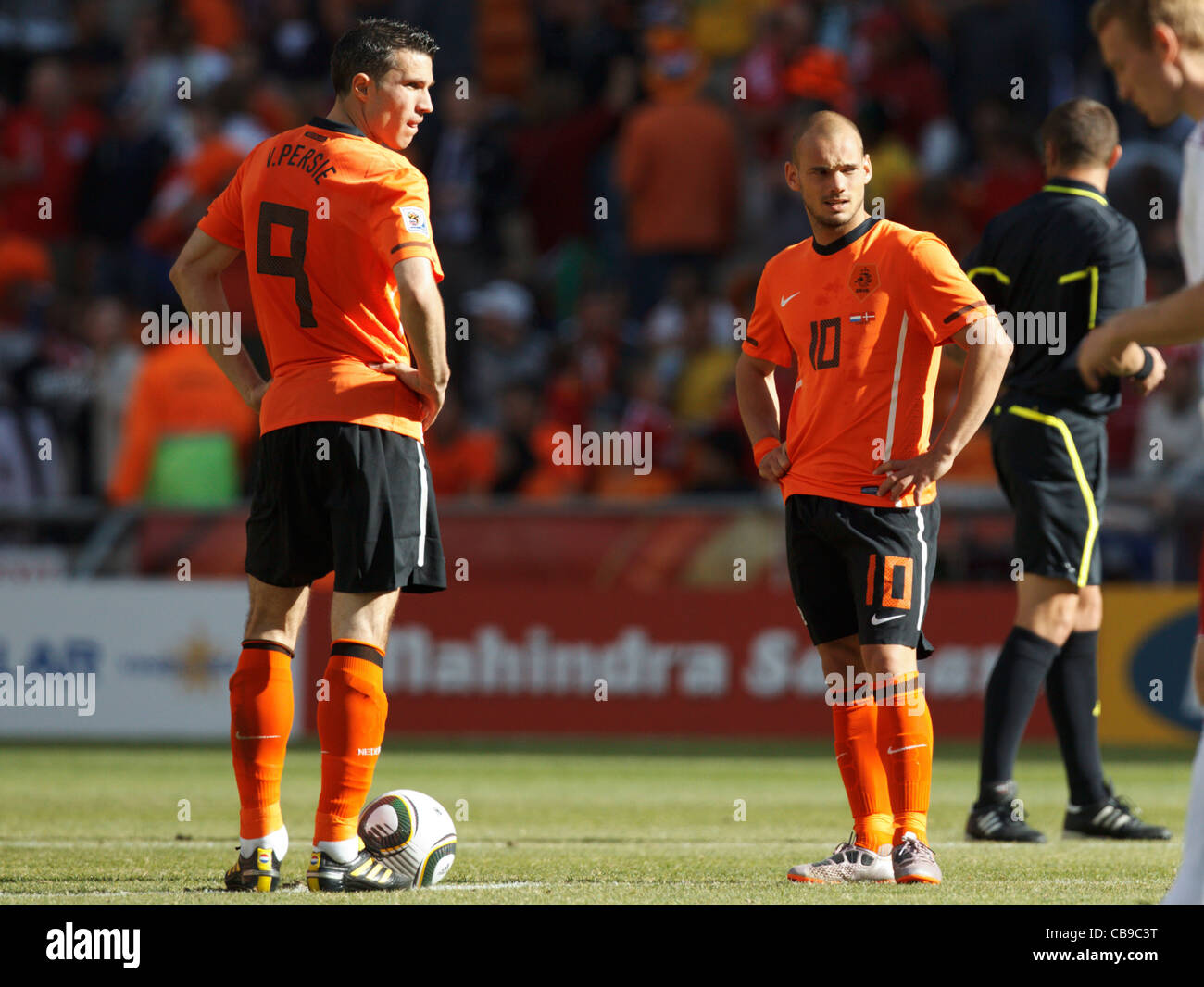 Holland players Robin van Persie (L) and Wesley Sneijder wait to kick off the second half of a World Cup match against Denmark. Stock Photo