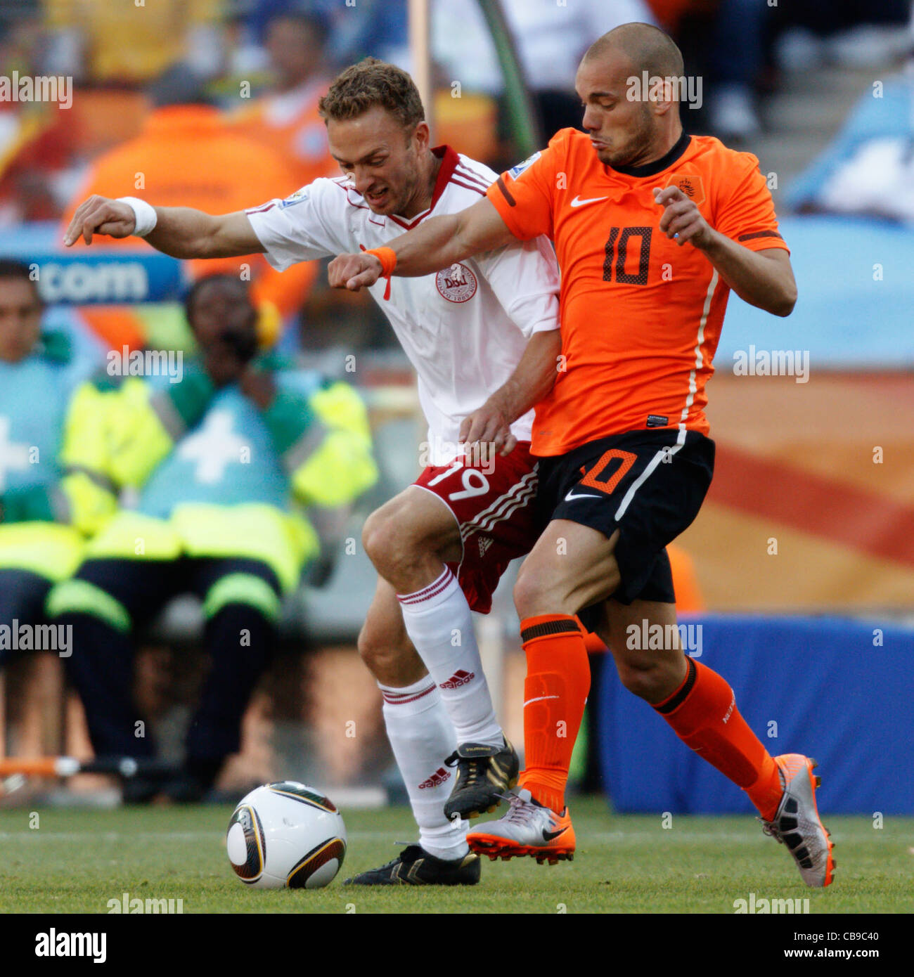 Dennis Rommedahl of Denmark (L) and Wesley Sneijder of the Netherlands (R) fight for the ball during a 2010 World Cup match. Stock Photo