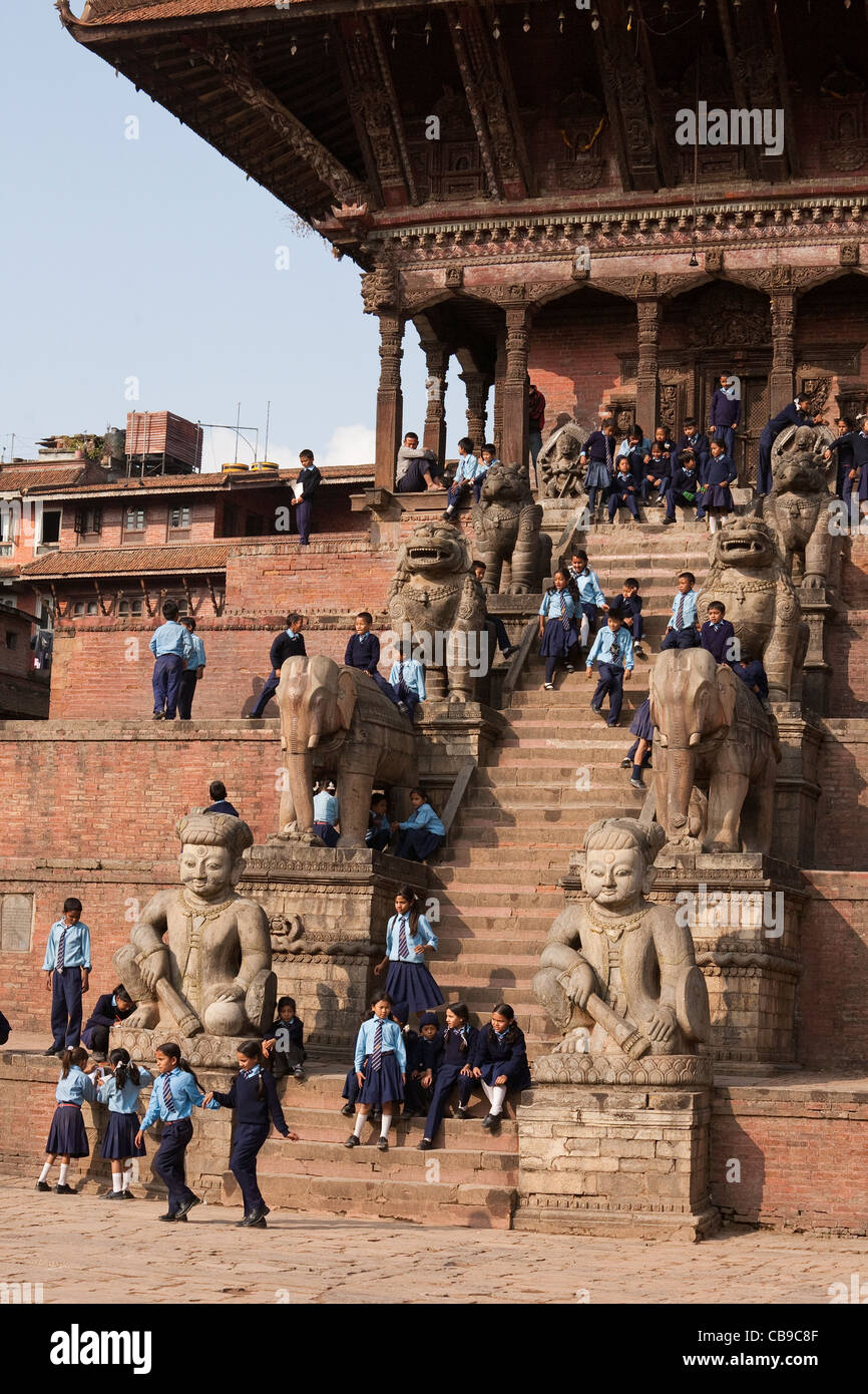 School children gathering at Nyatapola Temple - Bhaktapur, Kathmandu Valley, Nepal Stock Photo