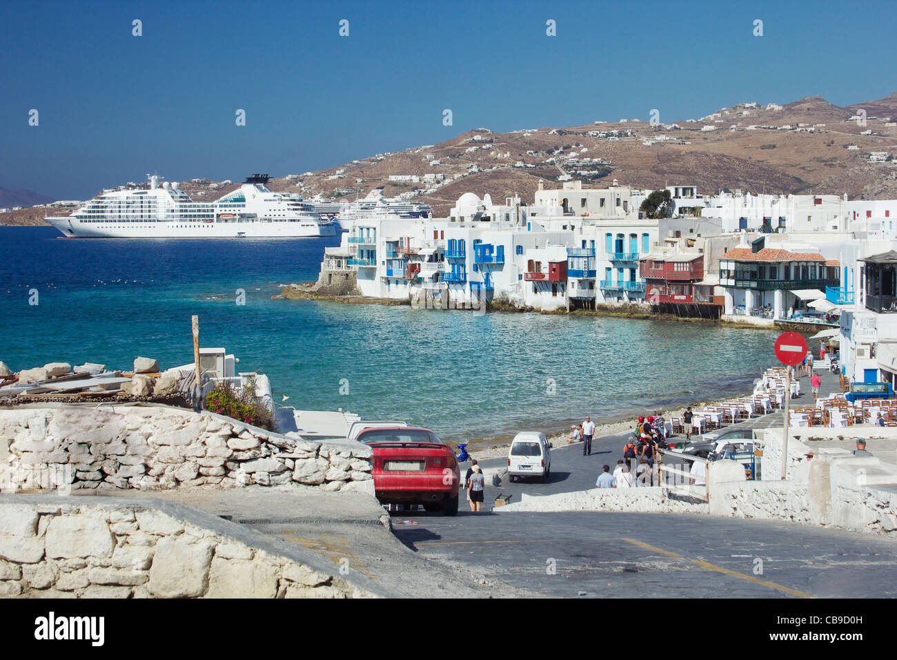 Cruise ship docked in the harbor of Mykonos, Greece. Stock Photo