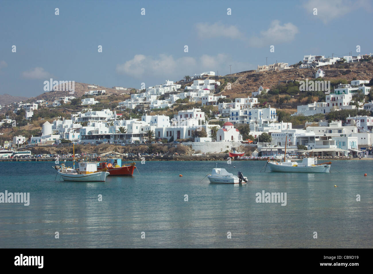 Buildings and boats around the harbor of Mykonos, Greece. Stock Photo