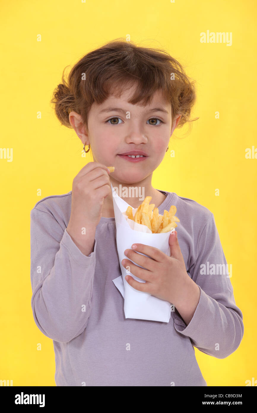 Girl eating a bag of chips Stock Photo Alamy