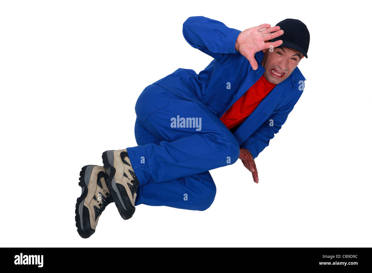 Terrified man lying on the floor Stock Photo Alamy