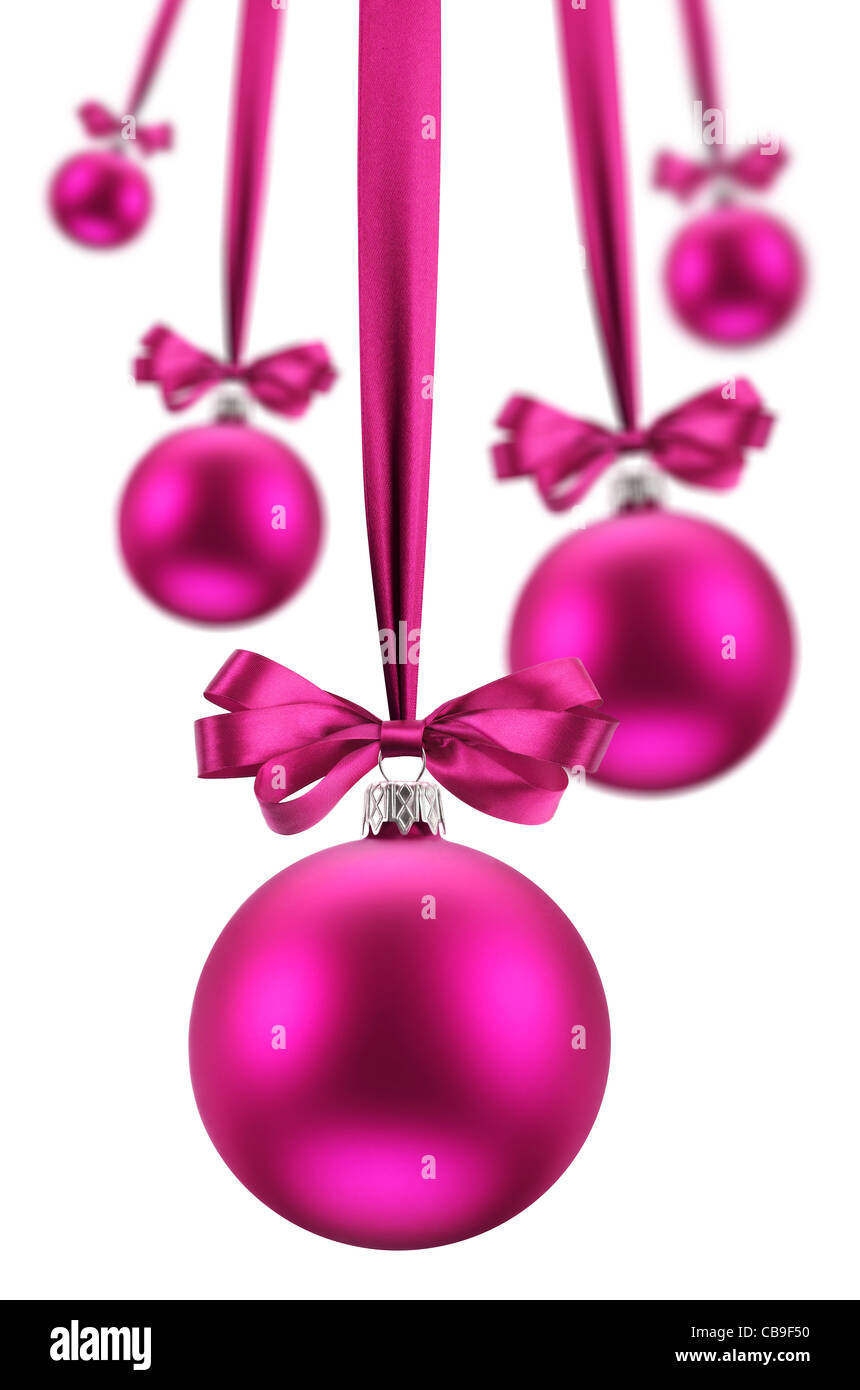 Christmas balls hanging pink ribbons on holiday. The image on white background. Stock Photo