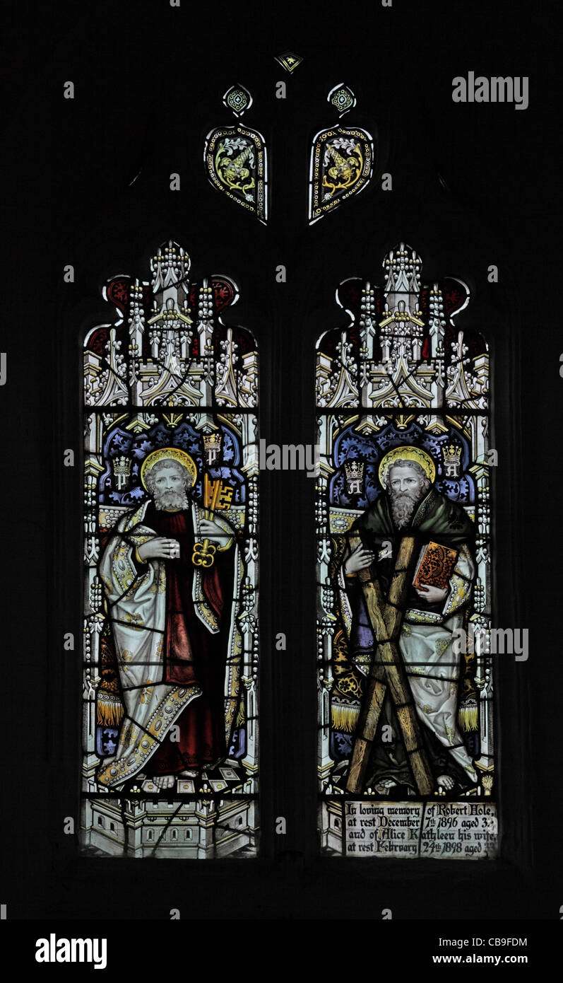 Stained glass window by the Kempe Studios depicting Saints Peter and Andrew, St Andrew's Church, Old Cleeve, Somerset, England Stock Photo