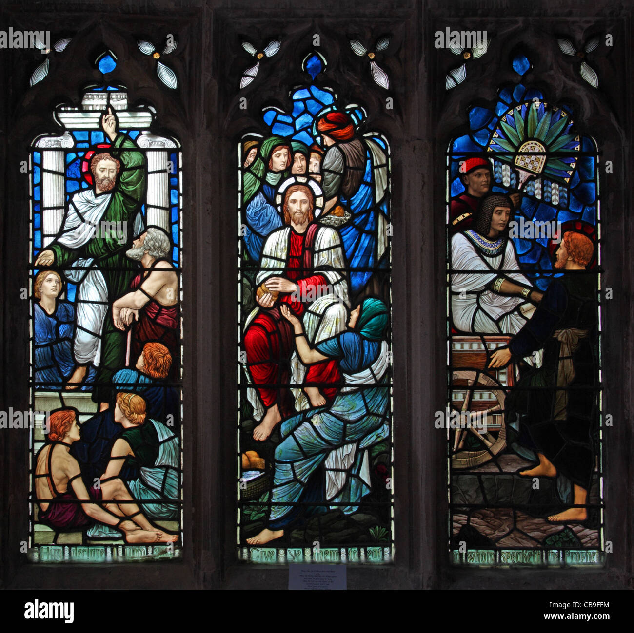Stained glass window by Morris and Co. depicting Scenes in the Life of Christ, St Andrew's Church, Old Cleeve, Somerset, England Stock Photo