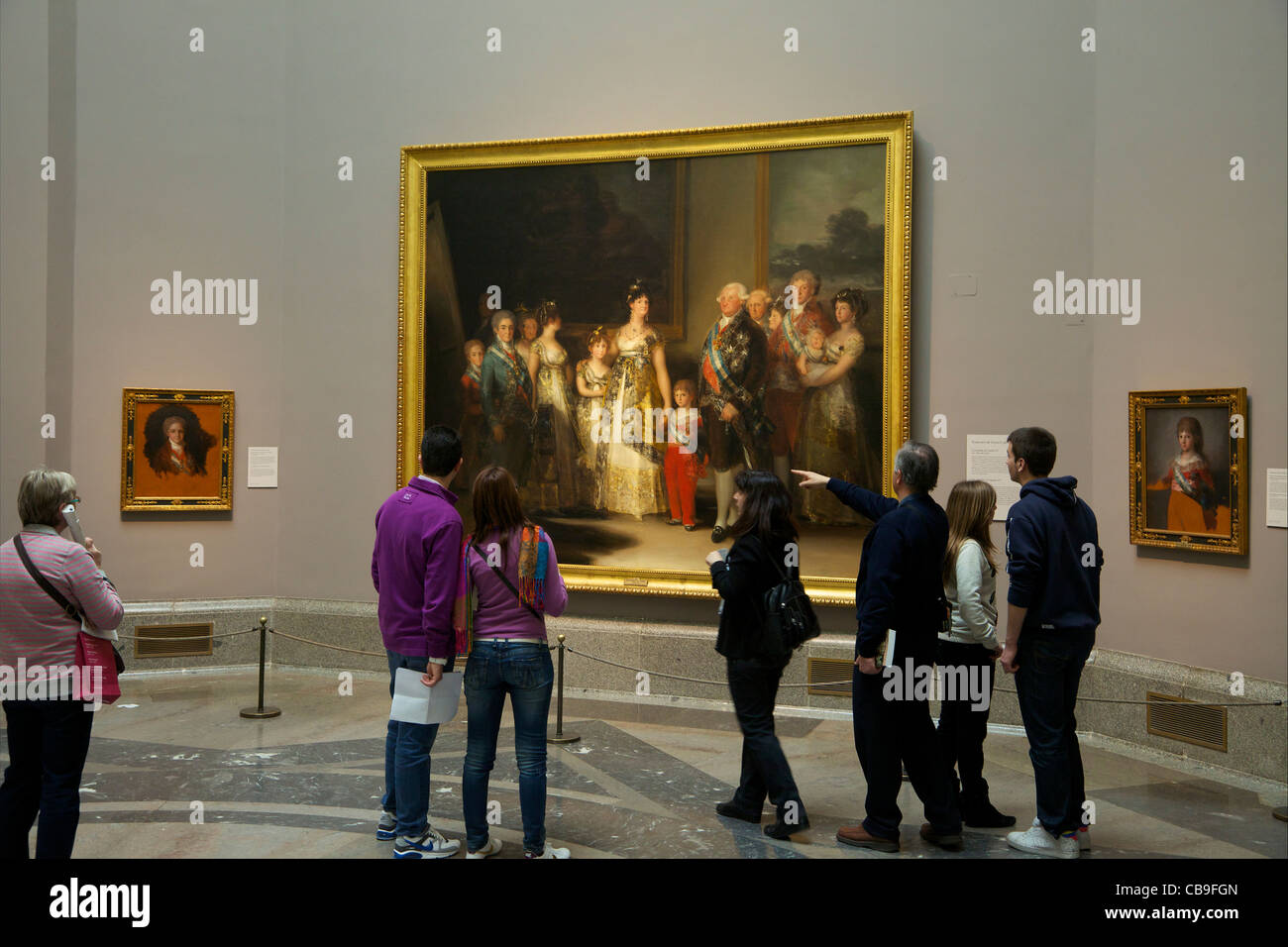 Visitors admire the Family of Charles IV, Francisco Jose de Goya y Lucientes, 1800-1801,  Museo Nacional del Prado Museum,  Madrid, Spain Stock Photo