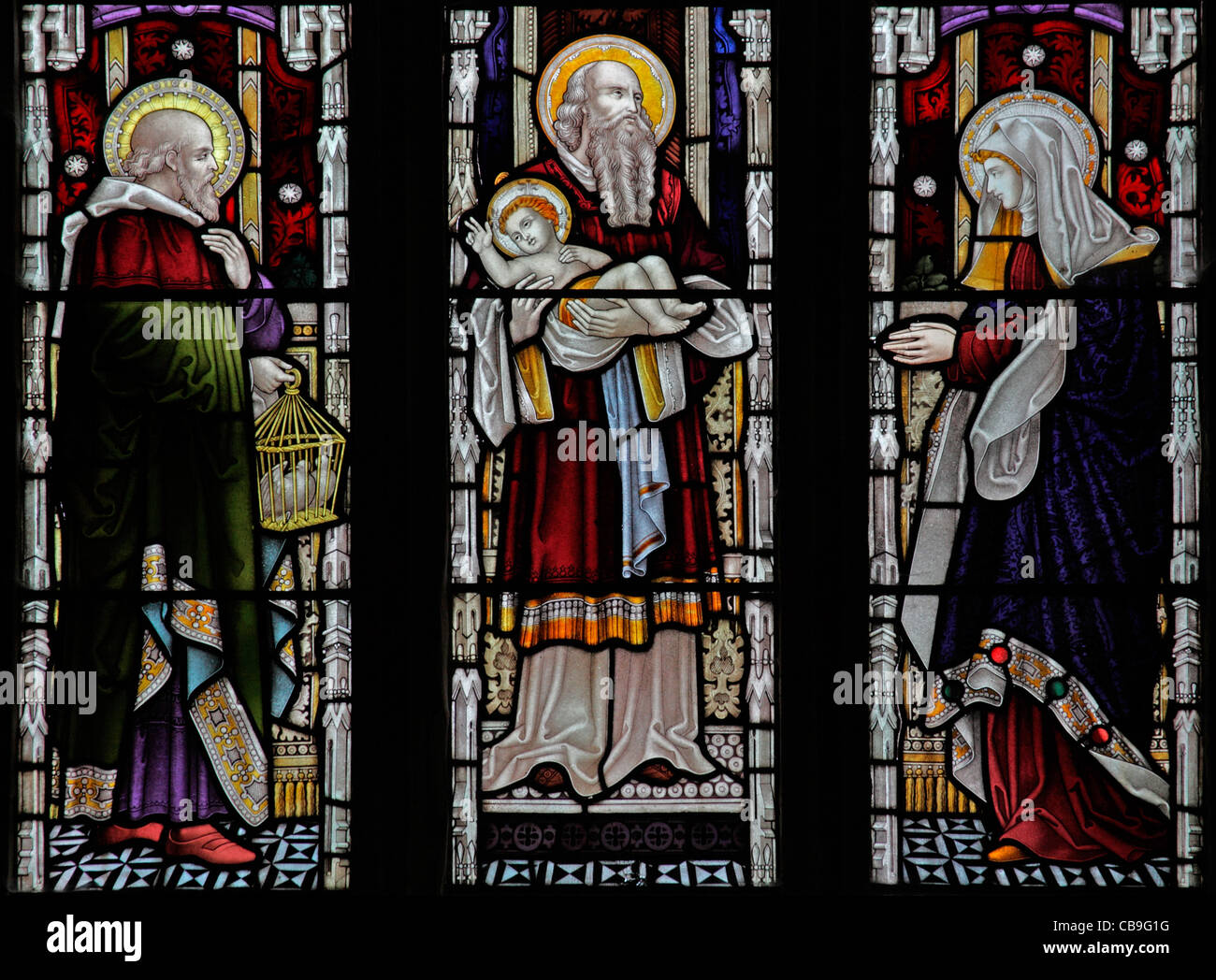 A stained glass window depicting The Presentation in the Temple, St Mary's Church, Molland, Devon, England Stock Photo