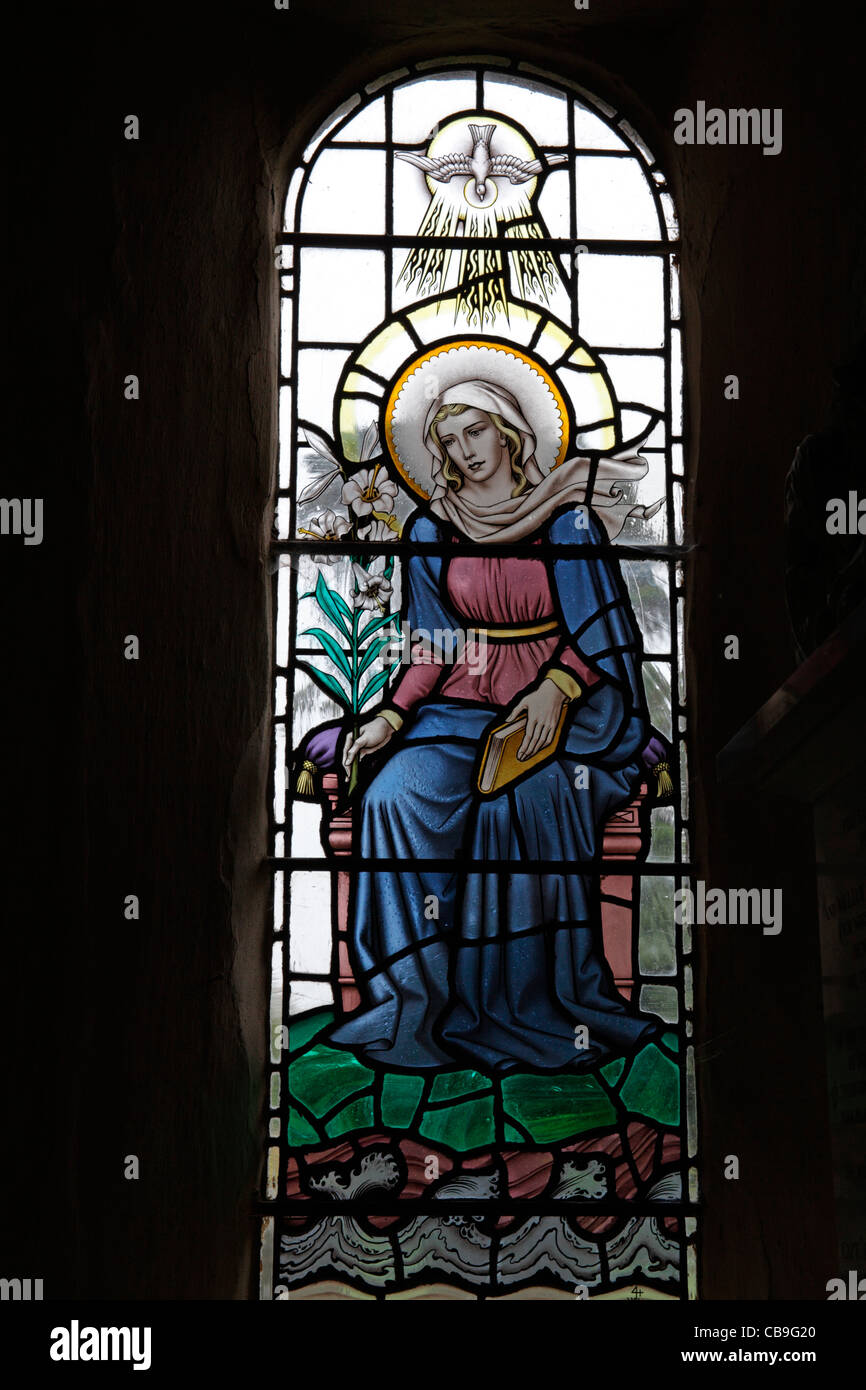 A stained glass window designed by George Bryan Cooper Abbs depicting The Virgin Mary, St Mary's Church, Molland, Devon, England Stock Photo