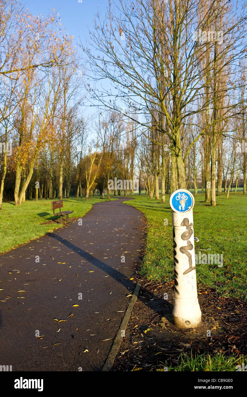 A cycling and walking sign on a path in Gloucester Park in Basildon Stock Photo