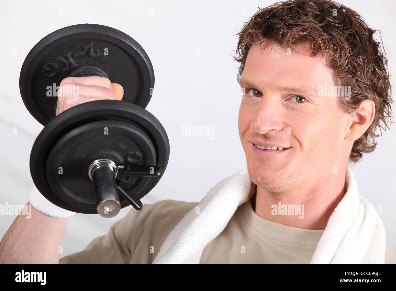 Young man 2kg dumbbell hi res stock photography and images Alamy