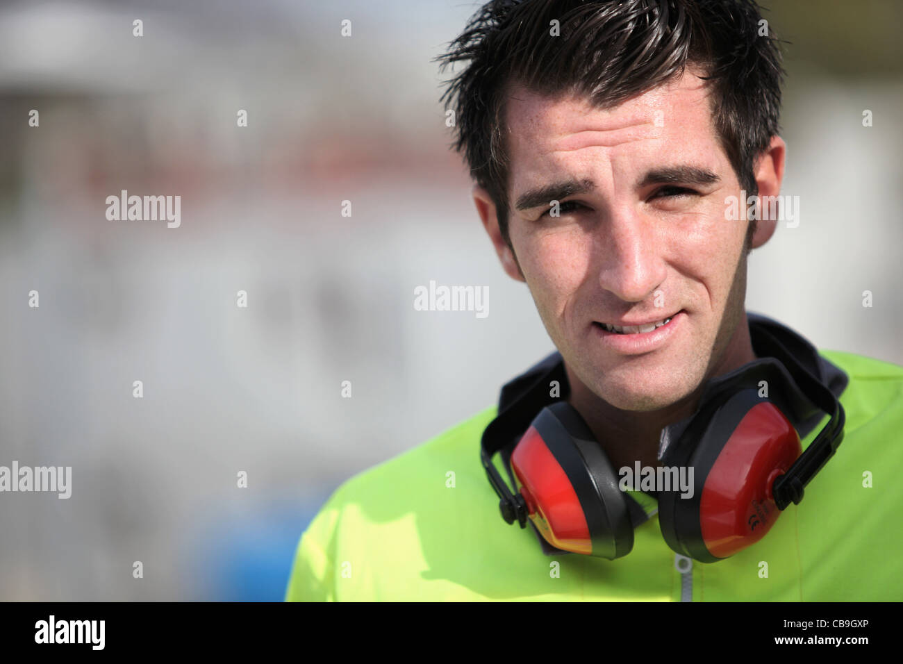 Man wearing ear defenders Stock Photo Alamy