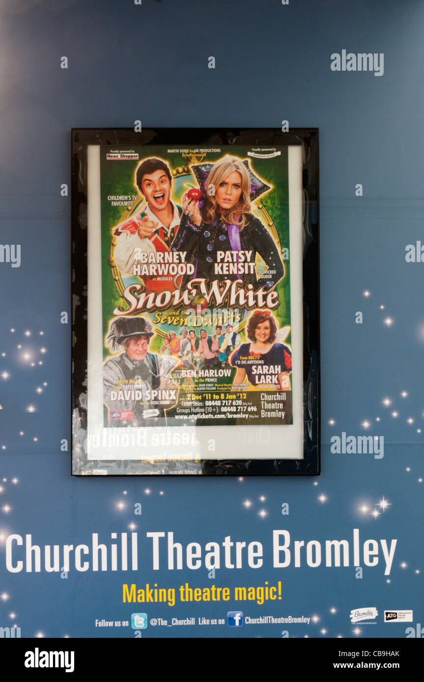 A poster for the Christmas pantomime of Snow White and the Seven Dwarfs outside the Churchill Theatre in Bromley, Kent. Stock Photo