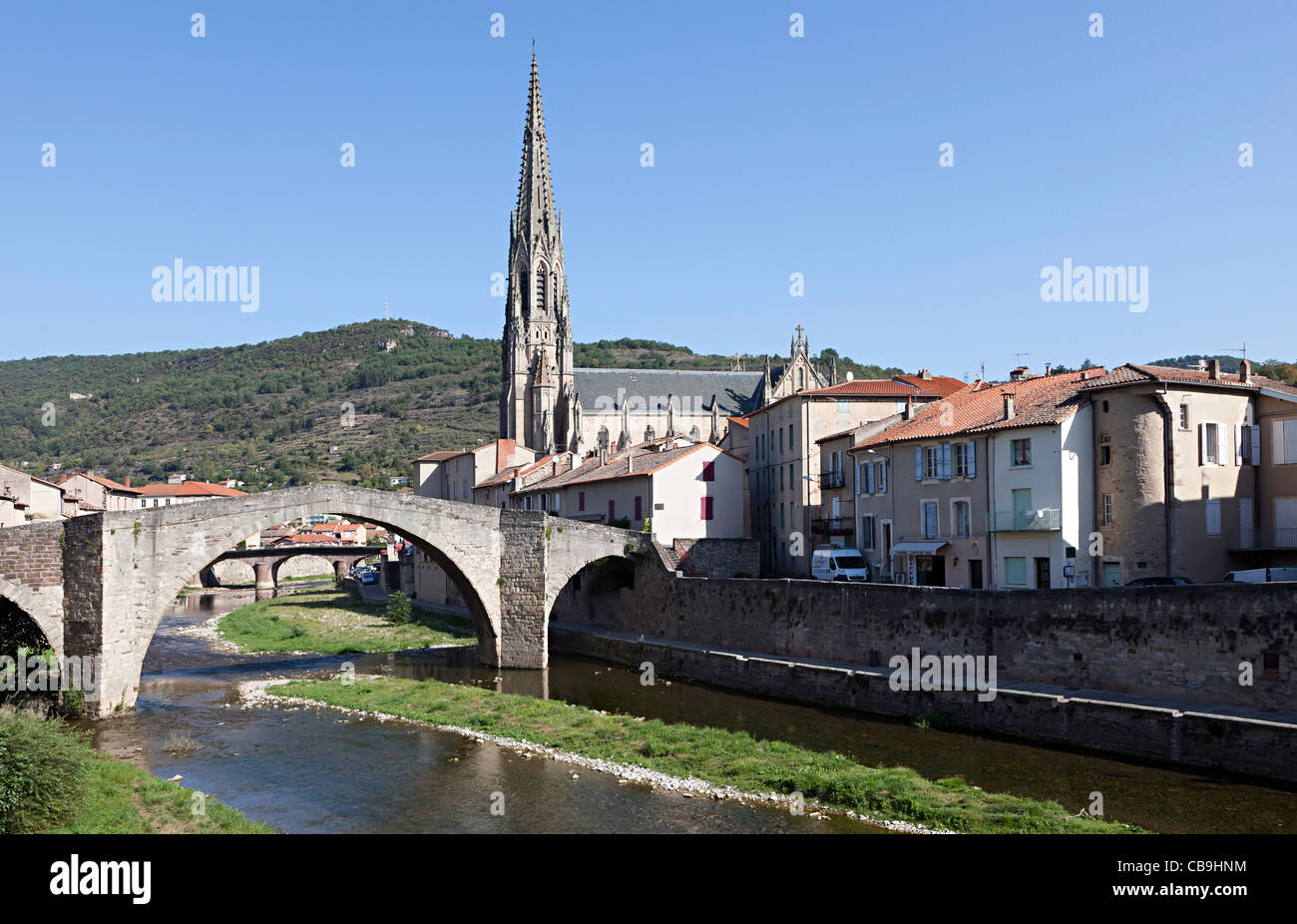 Church and bridge over river St Affrique Aveyron département Midi-Pyrénées region France Stock Photo