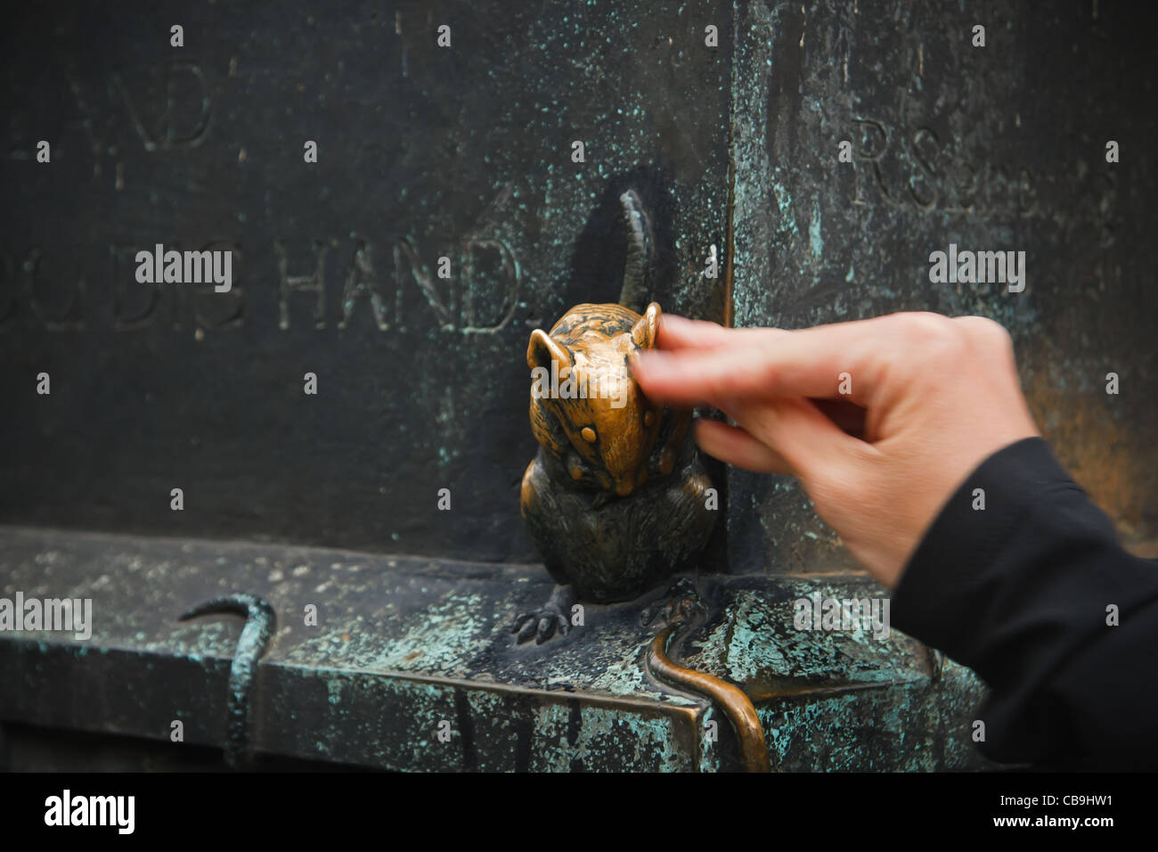 Figurine of rat - fragment of The holy Gertrude bronze statue at Gertraudenbruecke (Gertrude bridge), Berlin Mite, Germany. Stock Photo