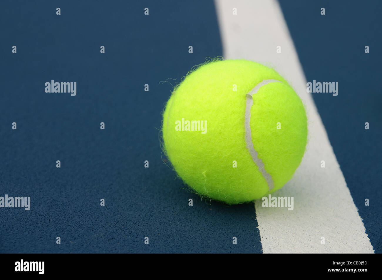 Tennis ball touching the line Stock Photo - Alamy