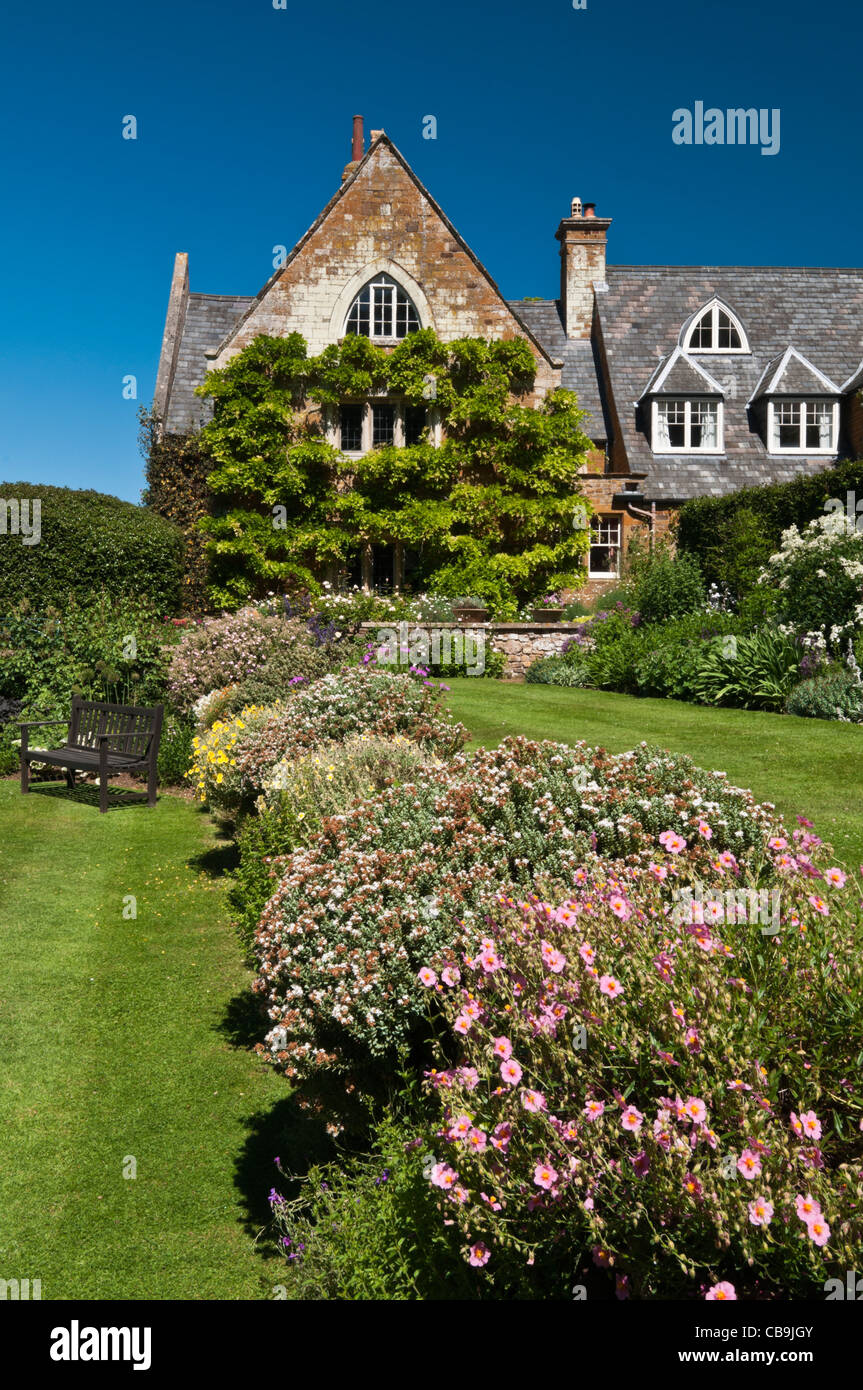 The raised Terrace Border and manicured lawns at Coton Manor Gardens, Coton, Northamptonshire, England Stock Photo