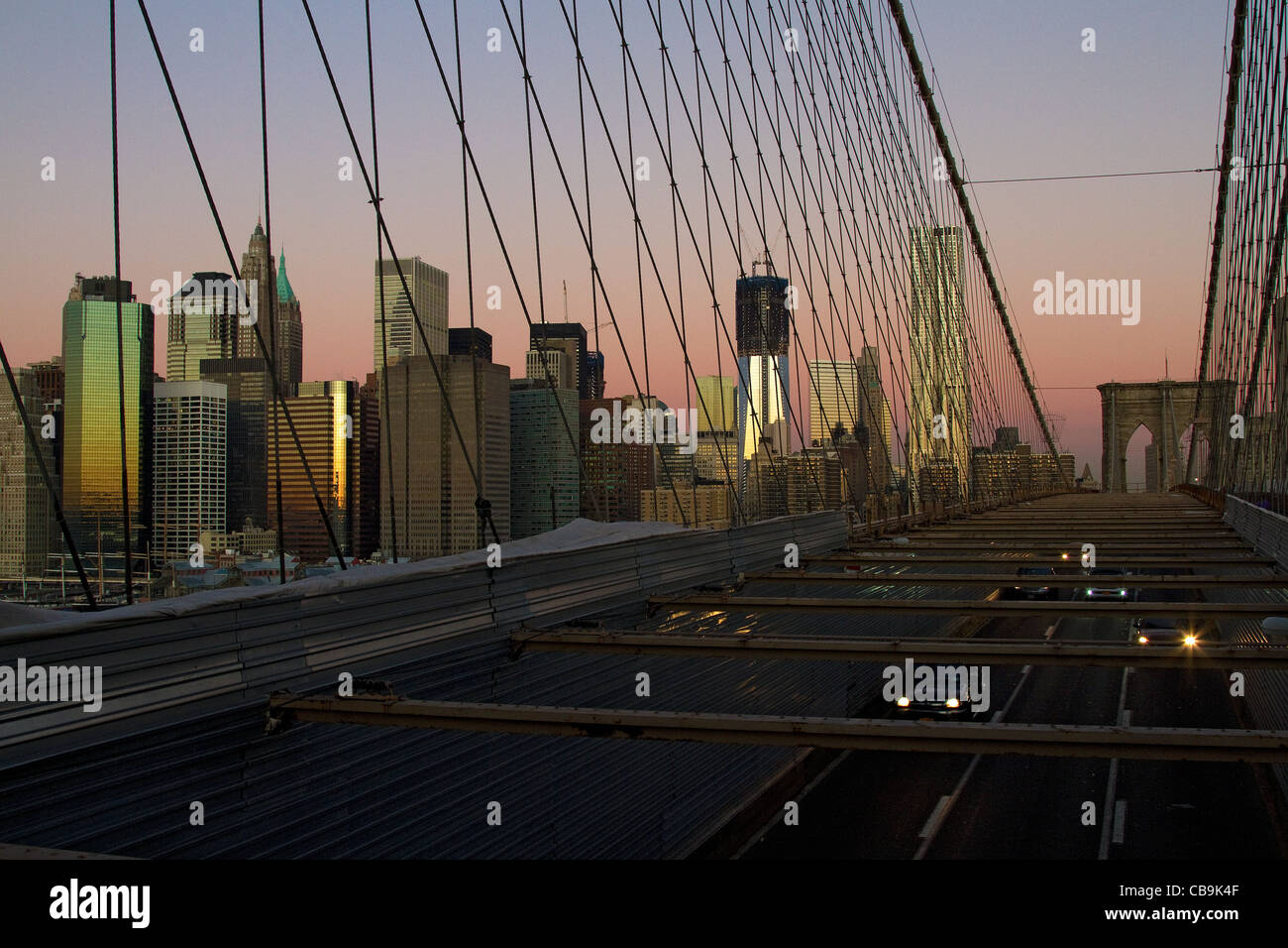 New York City, Manhattan, skyline during the beautiful colors of early morning sunrise, dawn from Brooklyn Bridge. Stock Photo