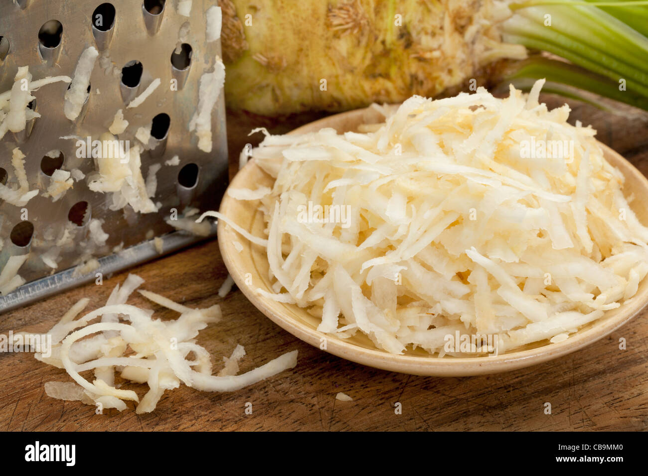 bowl of celery root (celeriac) grated for a salad grated for a salad Stock Photo
