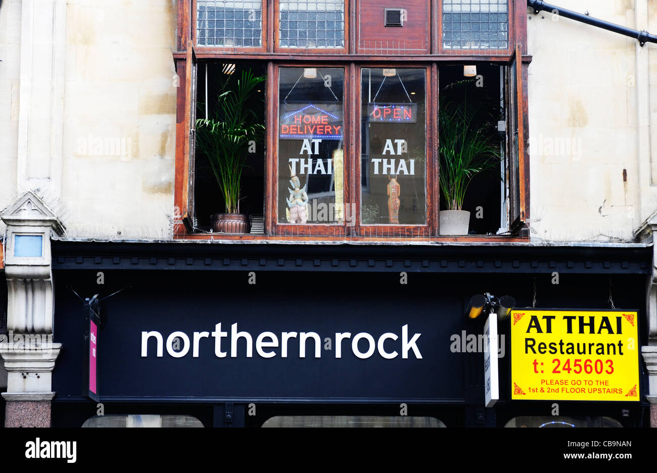 Northern Rock sign alongside a Thai restaurant sign in Oxford. UK. Stock Photo