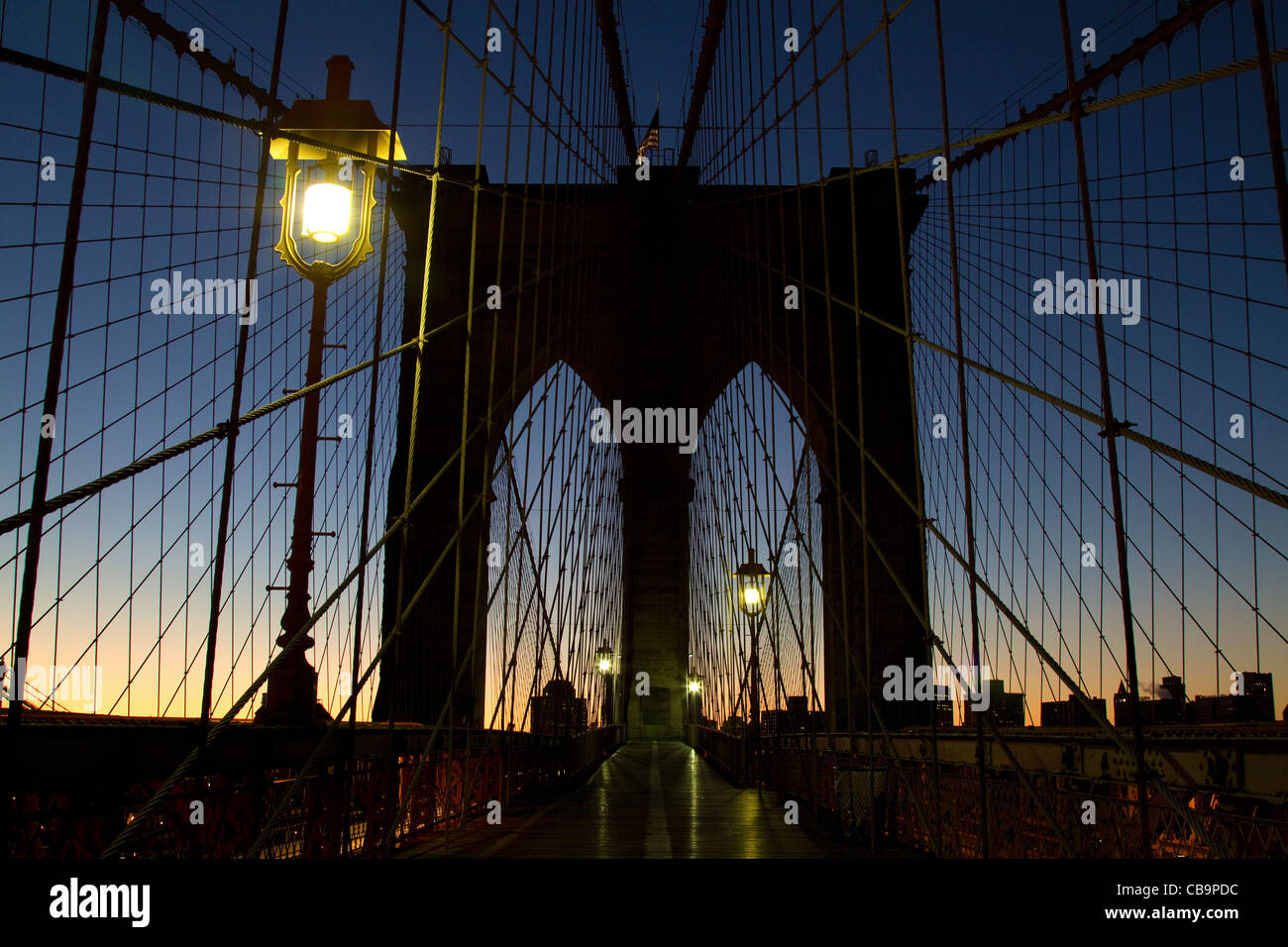 New York City, Brooklyn Bridge during the beautiful colors of early morning sunrise. Stock Photo