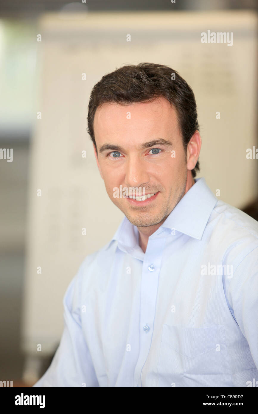 Portrait of a smiling teacher Stock Photo - Alamy