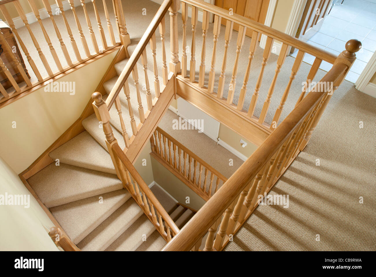 Abstract view down wooden domestic stairwell in house Stock Photo