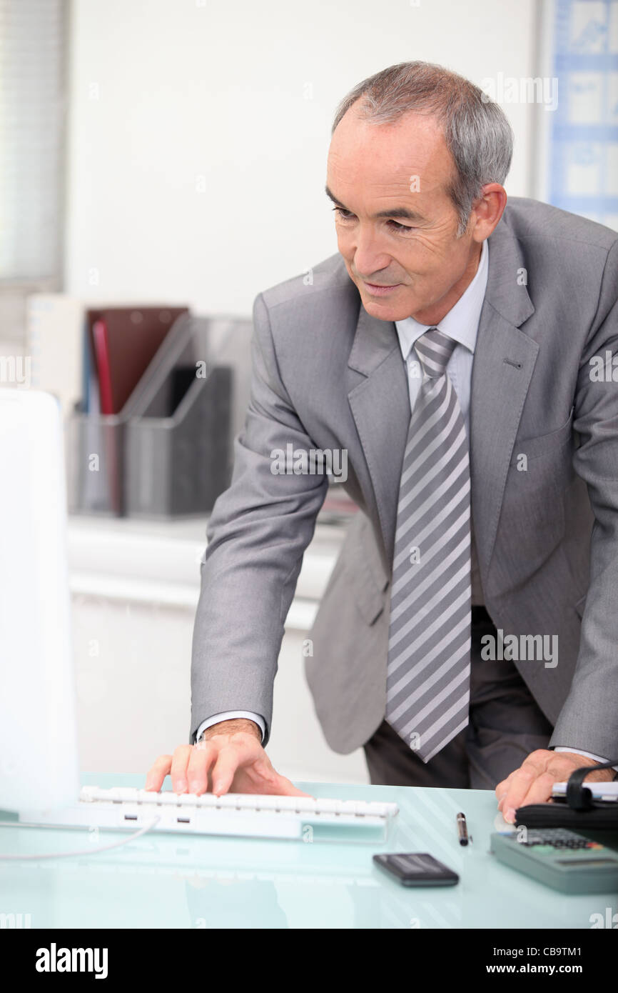 mature ceo working at office Stock Photo - Alamy