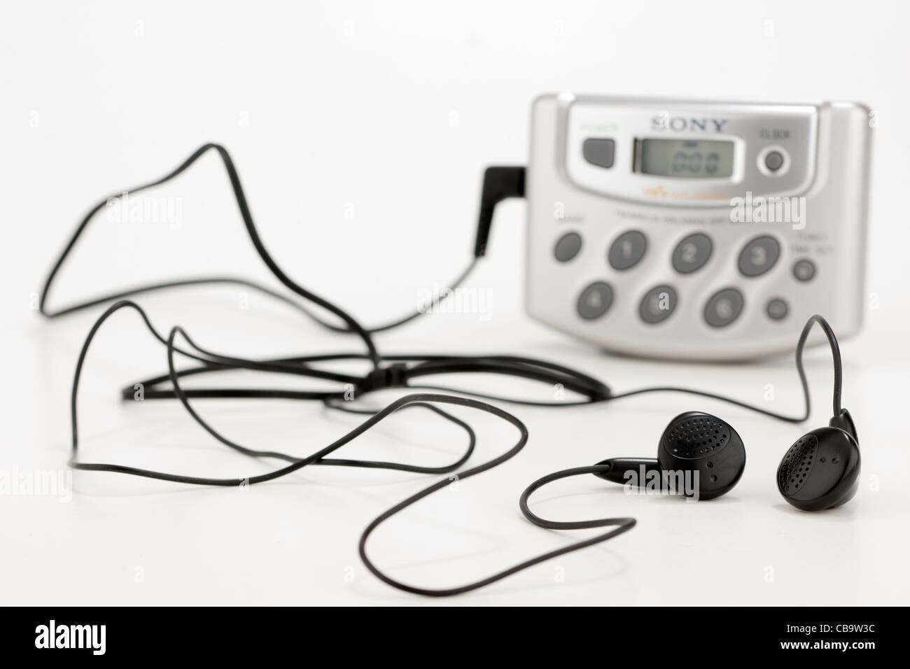 Portable personal Sony analogue radio and earphones Stock Photo