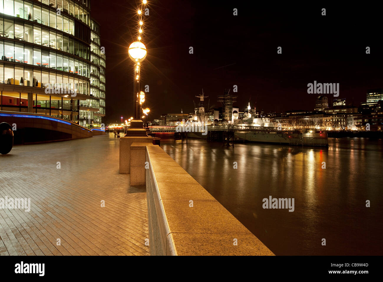 City of London along the river Thames at night Stock Photo