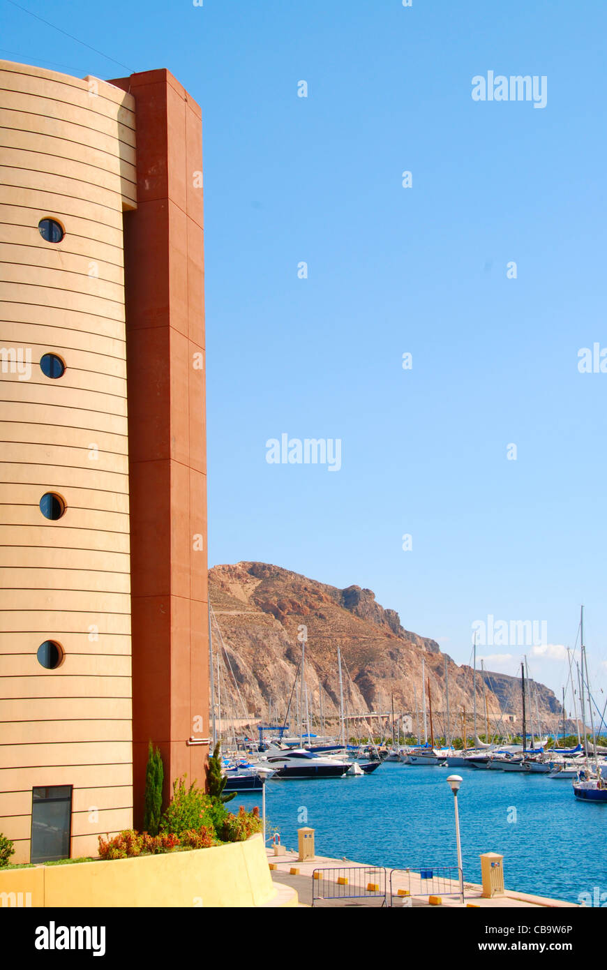 The control tower of Aguadulce Harbour, with the mountains in the background, on a typically beautiful Andalucian day. Stock Photo