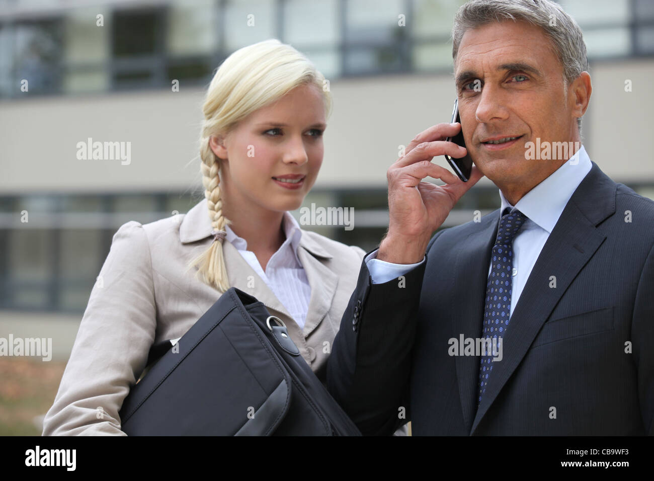 Ceo and assistant outdoors Stock Photo - Alamy