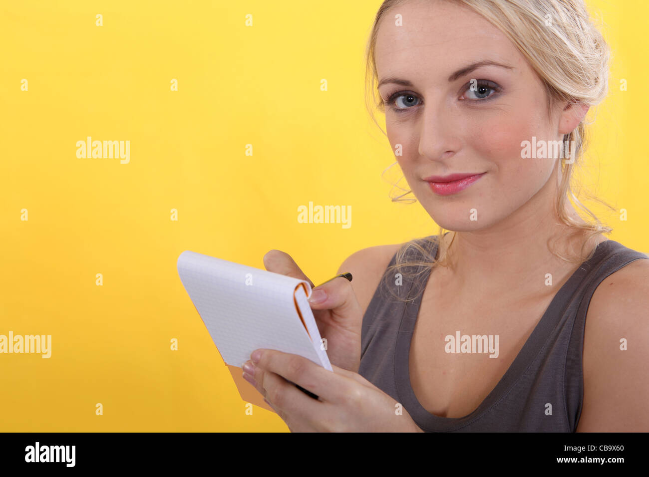 portrait of a woman with shopping list Stock Photo