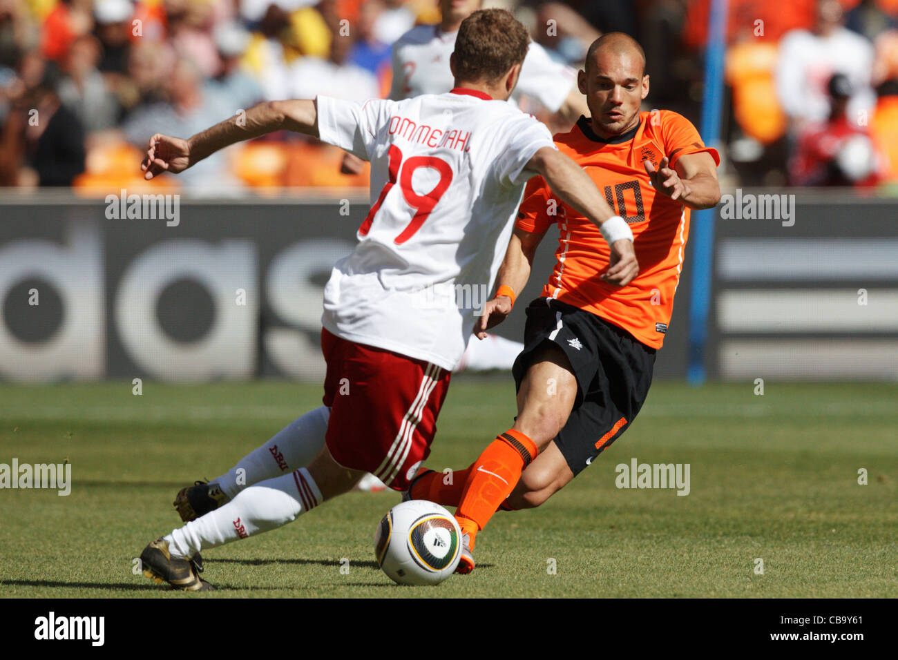 Wesley Sneijder of the Netherlands (R) in action against Dennis Rommedahl of Denmark (L) during a 2010 World Cup match. Stock Photo