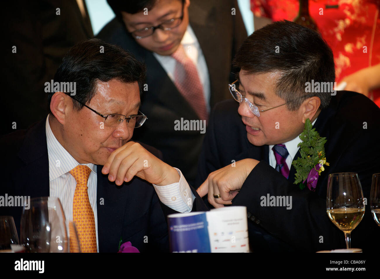 China's Commerce Minister Chen Deming talks with US Ambassador to China Gary Locke. 02-Dec-2011 Stock Photo