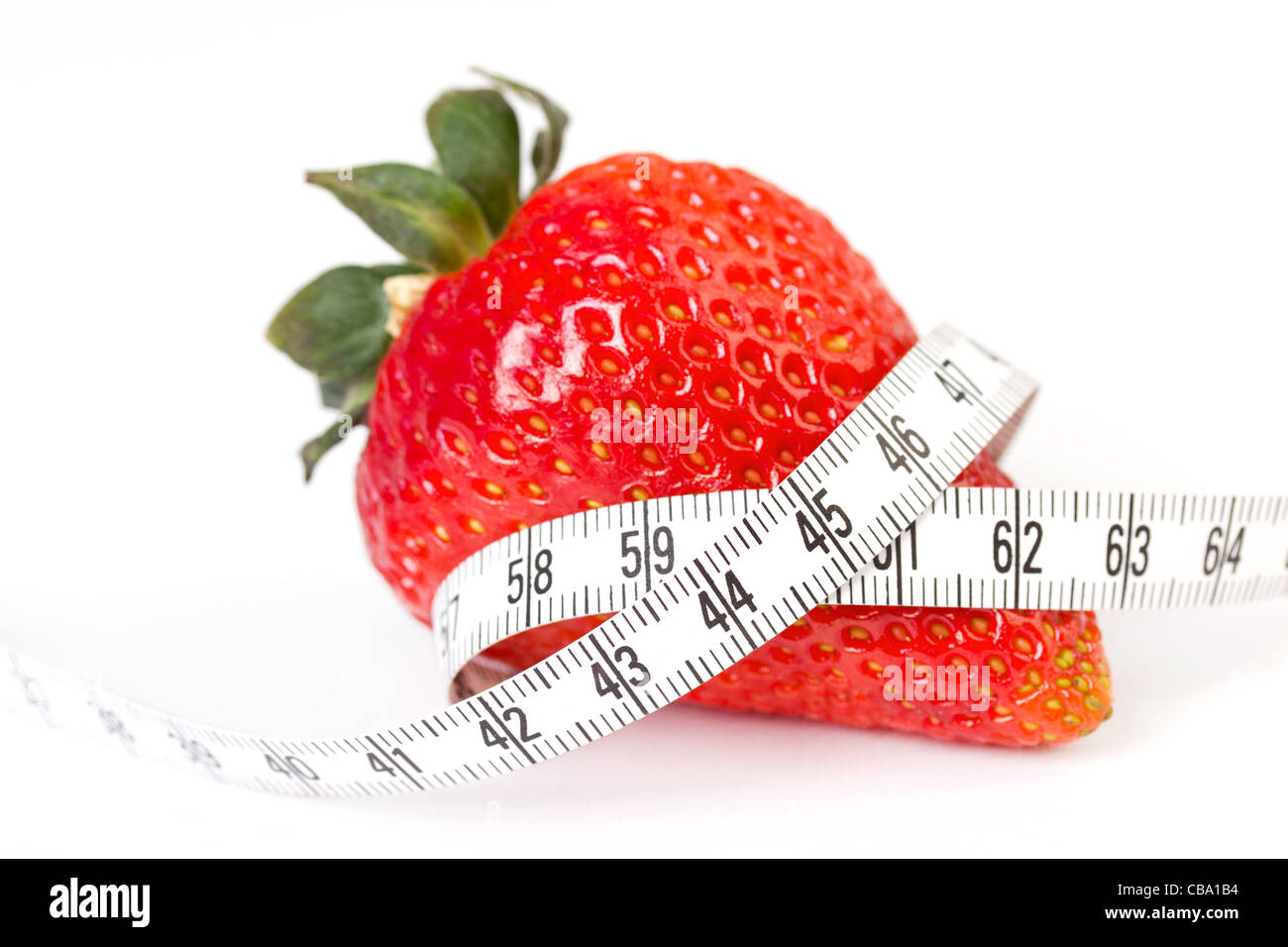 Strawberry with measure tape, closeup on white Stock Photo - Alamy