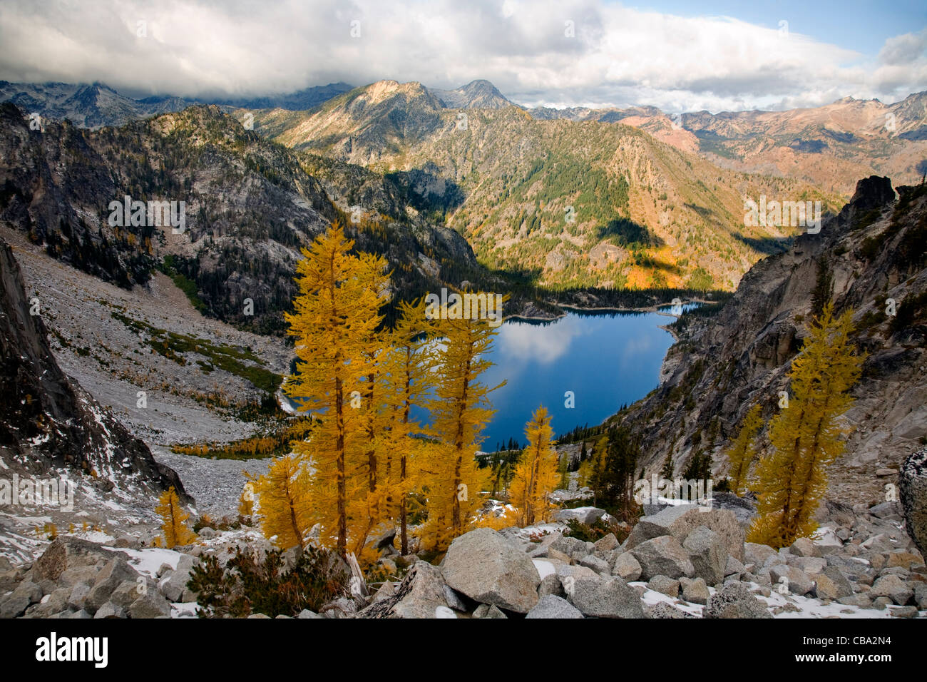 WASHINGTON - Larches in autumn colors above Colchuck Lake in the Stock ...